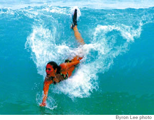 Hannah Thomas catches a wave at Sandy Beach’s dangerous shorebreak