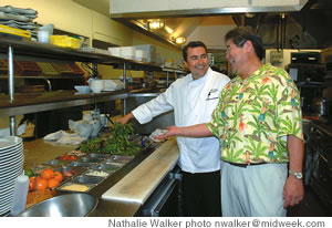 Derek Kurisu in the Pacific Club kitchen with executive chef Eric Leterc