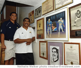 Junior and son Kingsley Ah You and their wall of fame