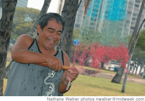 Salvador Savella crafts a fishing net at Ala Moana Beach Park