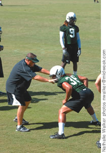 Coach Mac gets hands-on during a recent practice