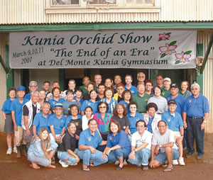 Kunia Orchid Society members gather in front of the Kunia Gym to promote their 53rd — and final — exhibit at the old community hall. Photo by Ron Harris.