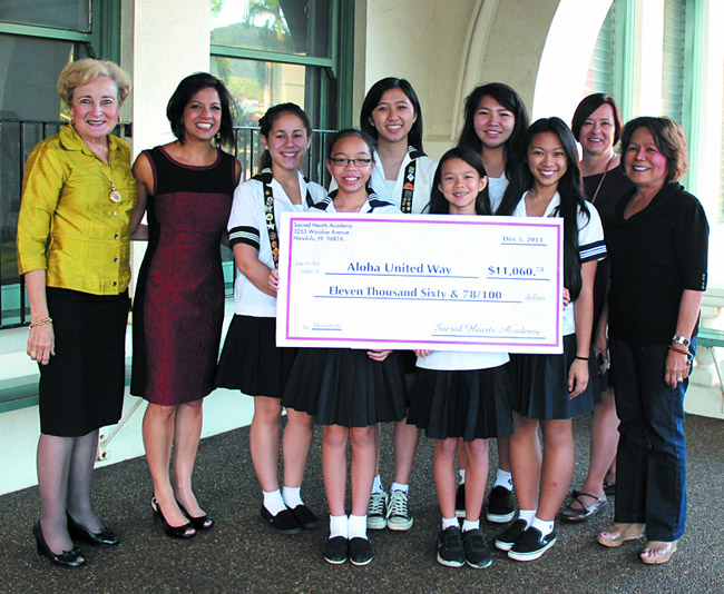 Sacred Hearts Academy students recently gave $11,060 to Aloha United Way, the results of fall semester fundraisers by both lower and upper school students. At the presentation were (front, from left) Aulii Ludington, Naia Lum, Angelique Racpan, lower school vice principal Remee Tam, (back) head of school Betty White, Aloha United Way's Kim Gennaula, Aina Katsikas, Angela Wong, Erica Freitas and student activities director Toni Normand. Photo from Hayley Matson-Mathes. 