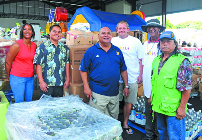 Cutter, Partners Support Philippines  Cutter Buick-GMC Waipahu's Philippines Disaster Fund Drive took place Nov. 23. Partnering with Lighthouse Outreach Center, Cutter sought donations from vehicles and passersby. The fundraiser is part of an ongoing effort at Cutter. The weekend prior to this event, it raised $15,000 along with 18 truckloads of food and supplies to be sent to the Philippines. Pictured are (from left) Alyson Stevenson, customer relations manager; Melvin Baguinon, sales manager; Pastor Joe Hunkin, Lighthouse Outreach Center; Jarrett Cutter, owner; Aiyaz Dean, general sales manager; and Geronimo Malabed, Geronimo Broadcasting owner. Photo by Lawrence Tabudlo, ltabudlo@midweek.com.  