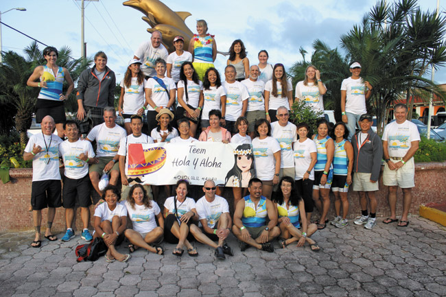 There were at least 40 triathletes representing Hawaii at the Dec. 1 IRONMAN race in Cozumel, Mexico. Some of them are pictured here, along with their supporters. Rick Keene photo