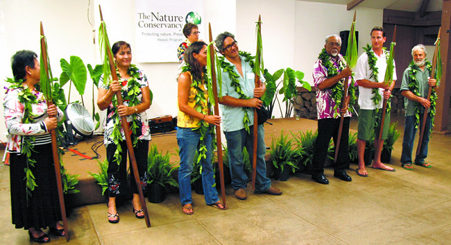 The Nature Conservancy presented its annual Kako'o Aina Award recently at He'eia State Park to seven Windward partners, represented by (front, from left) Jo-Ann Leong, Mahealani Cypher, Hi'ilei Kawelo, Rick Barboza, Jerry Kaluhiwa, Jono Blodgett and Charles Reppun. Photo from TNC. 