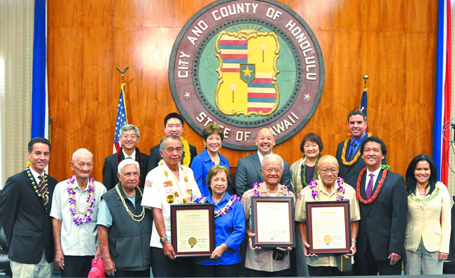 World War II veterans Angelicio Pegar, Francisco Obina, Ben and Anita Acohido, Lucio Sanico and Domingo Los Banos are presented with certificates of honor by members of the Honolulu City Council. Photo from City Councilman Ron Menor.