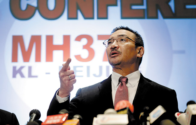 Malaysia's Minister of Transport Hishamuddin Hussein takes questions from the media March 13 during a press conference about the missing Malaysia Airlines jetliner that disappeared March 8 with 239 people aboard about an hour after leaving Kuala Lumpur for Beijing | AP photo/Wong Maye-E 