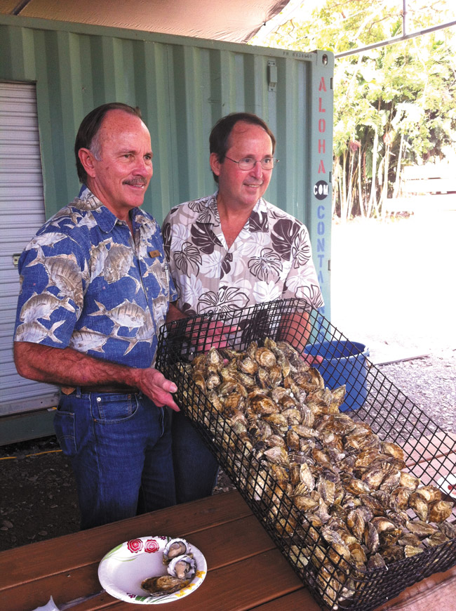 Kualoa Ranch president John Morgan (left) and his brother David, the ranch's agricultural director, show off a batch of freshly harvested oysters. Photo from Becker Communications. 