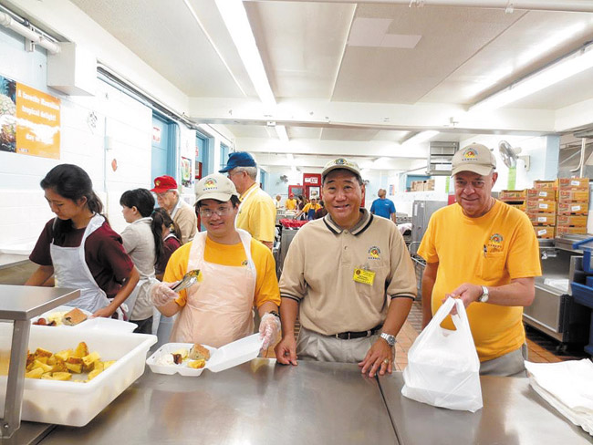 The community turned out March 9 to help Mililani Lions Club at its annual benefit breakfast at Mililani High School. Preparing the tasty meal for customers are (front, from left) Risa Askerooth, Jaelyn Tanga, Laura Ambrosecchio, Kamisha McKnight, (back) Mark Despault, Bailey Ilagan, Todd Kawamoto, Michael Magaoay and Richard Crislip. Photo by Lawrence Tabudlo, ltabudlo@midweek.com. 