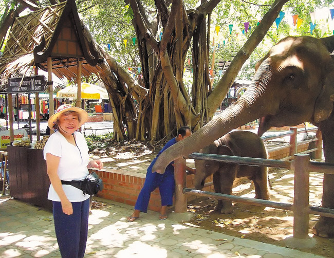 The author’s mother Joyce with new friends in Thailand. Photo from Jade Moon