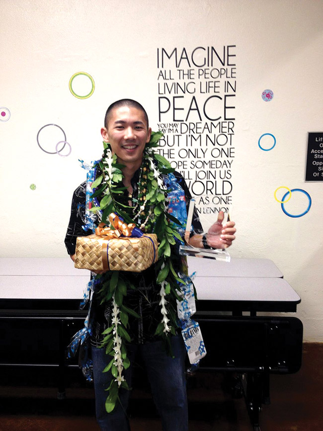 Kailua Intermediate School science teacher Ryan Kagami with his national Teacher of Promise award, which he received March 14 at the school. Photo from the state Department of Education.