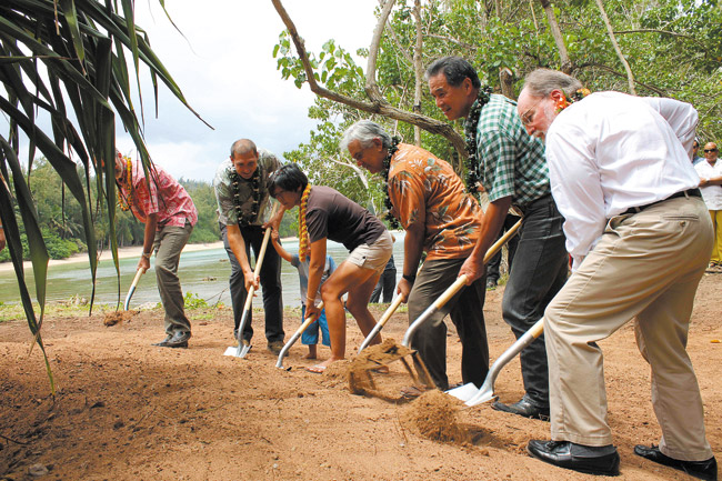 Following the official signing of HB 2434, a hala tree was planted May 19 at Kawela Bay by (from left) Turtle Bay Resort CEO Drew Stotesbury, Doug Cole of North Shore Community Land Trust, Lea Hong of The Trust for Public Land, city chief of staff Ray Soon, state Sen. Clayton Hee (Waialua, Laie, Heeia) and Gov. Neil Abercrombie. Similar hala tree plantings took place at Kahuku Point to create a symbolic connection between the resort's open lands. Photo from Turtle Bay Resort. 