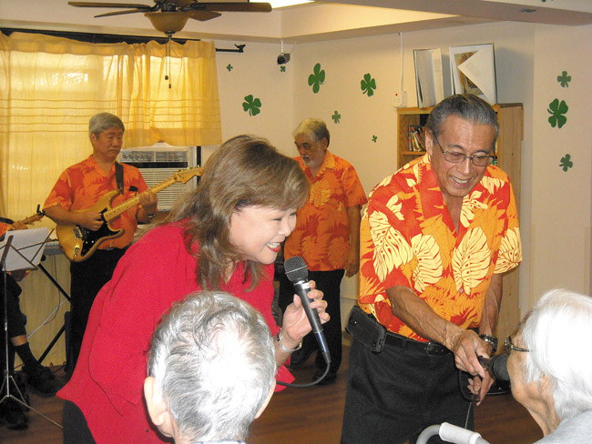 Amy Fukunaga and Barry Jay of Ebb Tides perform before their audience of kupuna during a St. Patrick's Day celebration at Manoa Cottage Kaimuki. Photo from Calvin Hara.
