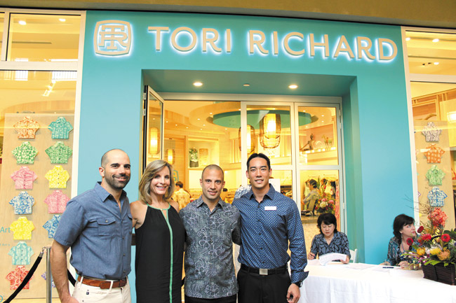 Tori Richard celebrated the opening of its new Ala Moana store in the Nordstrom wing, with a special event featuring entertainment by Taimane and pupus by chef Wade Ueoka of MW Restaurant. Pictured here are Tori Richard president/CEO Josh Feldman with wife Lori, Tori Richard general manager Jason Zambuto and MW Restaurant manager and wine director Ian Hatada.