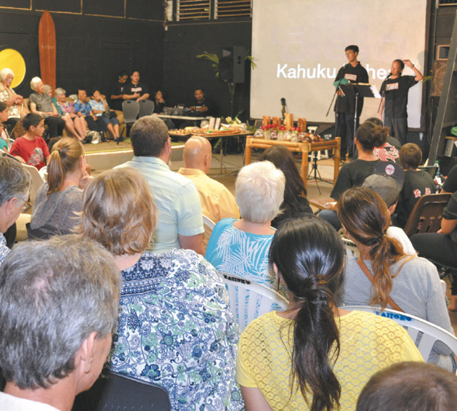 Kahuku Film Club members Ocean Eale (left) and Smylyn Naluai brief the crowd on the club's productions during the recent 'Olelo Kahuku Kahea. Photo by Siana J. Burgess.