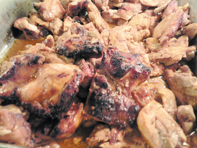This jerk chicken is marinated in a savory mix of spices and seasonings | Diana Helfand photo