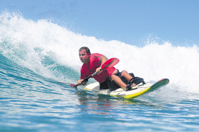 Active waterman Rich Julian displays his skills in one of many ocean sports he's mastered over the years. The Hawaii Kai man recently was honored with AccesSurf's 2014 Ocean of Possibilities Award. Photo from AccesSurf.