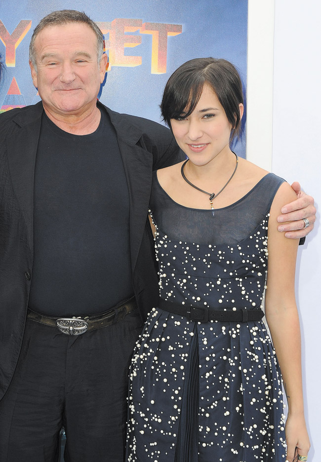 Actor Robin Williams (left) and his daughter Zelda at the premiere of 'Happy Feet Two' in Los Angeles. Williams was pronounced dead at his home in California Monday, Aug. 11. The preliminary investigation showed the cause of death to be a suicide due to asphyxia. AP PHOTO/KATY WINN