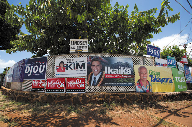 Signs on the corner of Waimano Home Road, Moanalua Road and Noelani Street in June during the primary campaign. ANTHONY CONSILLIO PHOTO 