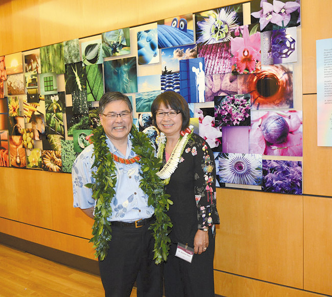 Drs. Kevin and Norma Hara stand by Pali Momi Medical Center's 'Spectrum of Life' mural, which they donated to the hospital. Photo from Patti Almirez. 