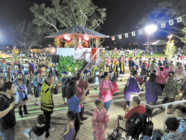 Crowds enjoy music, food and dancing at an earlier Autumn Festival and Bon Dance at Windward Community College. The fun this year runs from 4 to 9 p.m. Saturday on campus. Photo by Bonnie Beatson. 