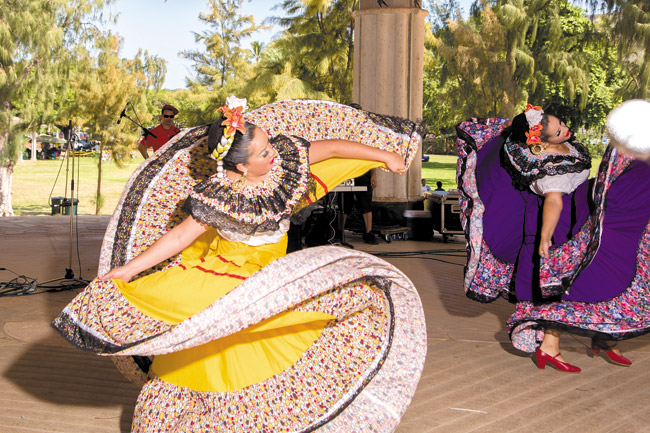 Mexican folk dancers from California-based Ballet Folkloric Costa de Oro twirl colorfully in traditional garments at the 2013 Hispanic Heritage Festival PHOTOS COURTESY OF LOPAKA PHOTOGRAPHY HAWAII 