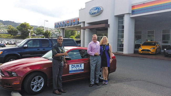 Republican gubernatorial candidate Duke Aiona with Mark and Mary Benson, owners of Honolulu Ford DAWN O'BRIEN PHOTO