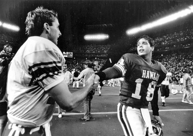UH quarterback Garrett Gabriel is congratulated by BYU's Ty Detmer after the big win. Note the packed stadium HONOLULU STAR-ADVERTISER PHOTO 