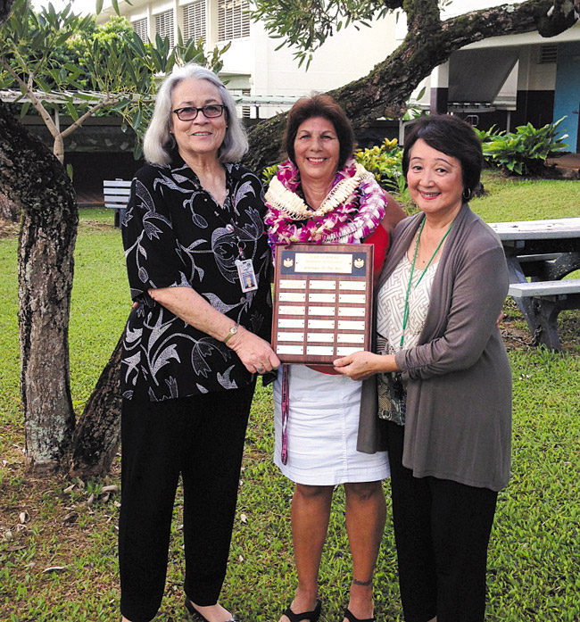 Monica DeCosta (center) with Castle-Kahuku Complex area superintendent Lea Albert (left) and principal Naomi Matsuzaki last month at Kahaluu Elementary after she was named DOE Employee of the Year. She now officially is Hawaii's top state employee overall for 2014. Photo by Marissa Catalano. 