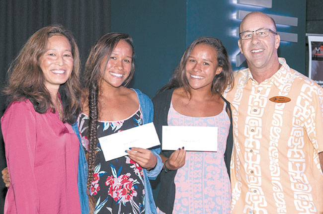 Turtle Bay Foundation presented scholarships in Dec. 2 ceremonies to Kahuku High School seniors Tasha (left) and Tiffany Kahaulelio in recognition of their outstanding academics and service to Ko‘olauloa and the North Shore. Pictured along with the recipients are Turtle Bay Resort VP and general manager Danna Holck (far left) and Turtle Bay CEO Drew Stotesbury. Photo by garyhofheimerphotography.com.