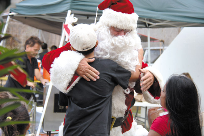 Children of inmates meet Santa while visiting their moms, thanks to Star Light, Star Bright, part of the Catholic Diocese Prison Ministry PHOTO FROM HAWAII CATHOLIC HERALD