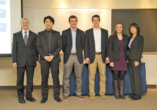 Michelle Whaley (far right) with University of Notre Dame provost Thomas Burish (far left) and biology major students (from left) Jonathan Jou, Jeffrey Hanse, Mark Brahier and Elena Brindley. The students work with Whaley and all were awarded a national honor as University Innovation Fellows, a program out of Stanford University. Photo courtesy University of Notre Dame. 