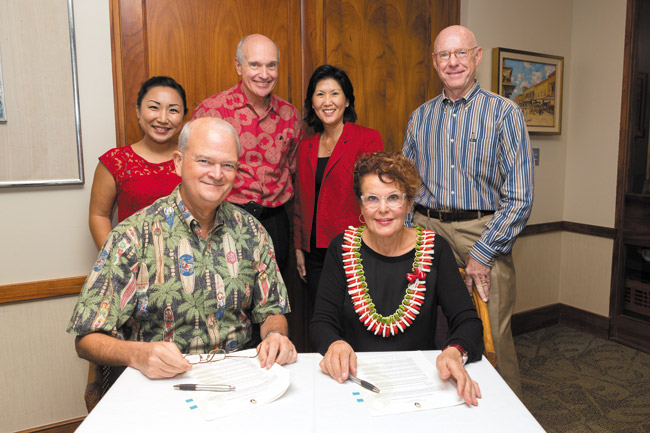 Sharon Weiner (seated at right) recently donated to UH's Pacific Asian Center for Entrepreneurship to support its physical expansion and program growth. Also pictured are (from left) Unyong Nakata, senior director of development, UH Foundation-Shidler College of Business; Vance Roley (seated), dean, Shidler College of Business; John Dean, chairman & CEO, Central Pacific Bank; Susan Yamada, executive director, Pacific Asian Center for Entrepreneurship; and Michael Coppes, director of estate and gift planning, UH Foundation PHOTO COURTESY UH 