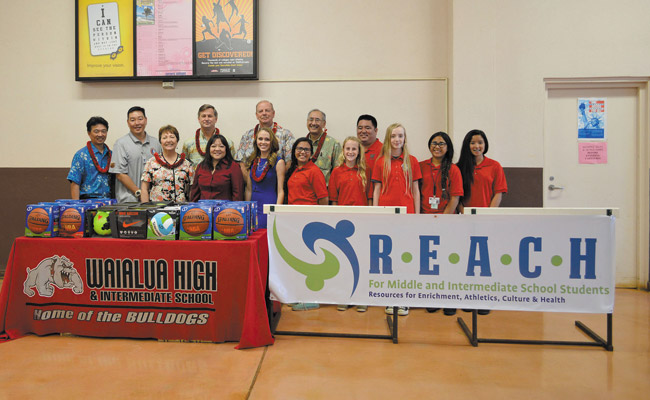 Representatives from government and businesses join Waialua faculty and students March 3 upon receipt of the equipment purchased by R.E.A.C.H. Photo courtesy Lt. Gov. Shan Tsutsui's office. 