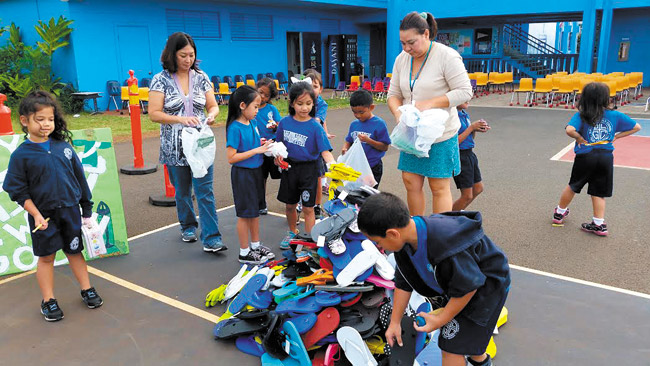 Students from Our Lady of Good Counsel School collected more than 400 pairs of slippers to benefit less-fortunate keiki on the Leeward coast. Photo from Ginger Kamusugi. 