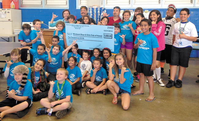 Clubhouse director Maureen Purington (back, left), with brothers Rick and Jesse Kiakona, shares a rich moment with Boys & Girls Club of Hawaii's Windward Clubhouse members at the Boots & Kimo's Jan. 16 check presentation. Photo from Maureen Purington.