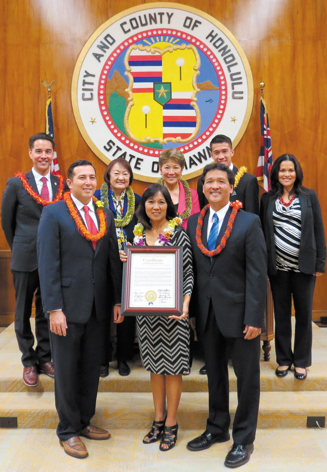 Waimanalo's Sea Life Park and its new general manager, Valerie King (holding the certificate), were honored recently by the City Council for offering residents and visitors a half-century of entertainment, education and marine conservation. Present at the Jan. 28 ceremony were (from left) Councilmembers Joey Manahan, Trevor Ozawa, Ann Kobayashi, Carol Fukunaga, Ron Menor, Brandon Elefante and Kymberly Pine. Photo from Ron Menor's office. 