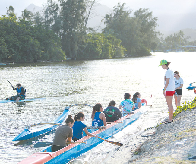 Coach April Nakayama gives tips to Kalaheo High School's girls varsity canoe team late last year during practice. It's one of many teams and clubs that paddle at Kailua BODIE COLLINS PHOTO 