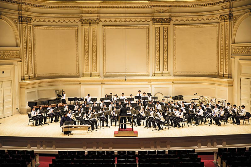 Susan Oshi-Onishi conducts Kaimuki Middle School Symphonic Winds at Carnegie Hall. PHOTO FROM KAIMUKI MIDDLE SCHOOL