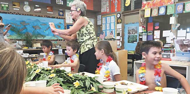 Mrs. Petey Kaneshiro, Holy Nativity School kindergarten teacher, during her class luau TANNYA JOAQUIN PHOTO