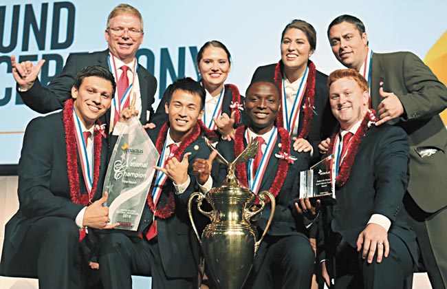 BYU-Hawaii Enactus team members and advisors celebrate their victory April 16 in St. Louis. Pictured are: (front, from left) Scott Fisher, Hao Hu, Sery Kouma Kone, Kevan Hendrickson, (back) Leslie G. Harper, Katherine Christensen, Taimi Kennerly and David Waite. PHOTO FROM BYU-HAWAII.