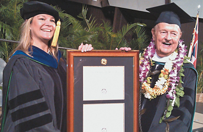 Tom Moffatt receives his honorary degree from Honolulu Community College Chancellor Erika Lacro PHOTO COURTESY YVONNE CABLAY