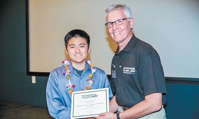 Ryan Nagai of Kapolei received the Frank Der Yuen Scholarship from Pacific Aviation Museum Pearl Harbor executive director Ken DeHoff. PHOTO COURTESY PACIFIC AVIATION MUSEUM PEARL HARBOR.