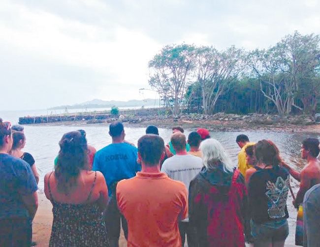 Guests and volunteers gather at the mouth of He‘eia Stream March 31 for the blessing of the He‘eia Estuary Restoration Project, which will tackle the bay’s invasive mangrove and other species that render the stream nearly impassable. PHOTO FROM HUI O KO‘OLAUPOKO.