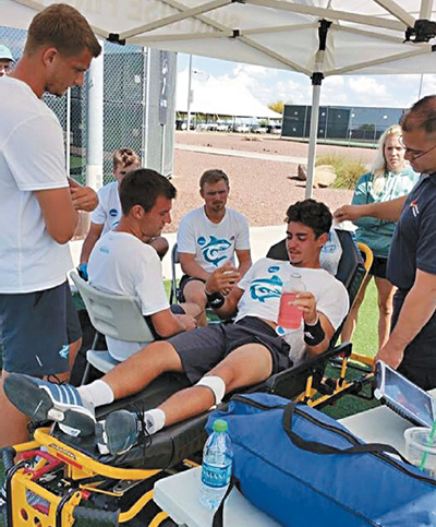 HPU’s Jaume Martinez-Vich receives necessary fluids after the NCAA title match PHOTO COURTESY VINCE BALDEMOR
