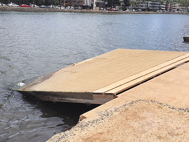 The heavily used Ala Wai Canal canoe launch is in disrepair, causing some paddlers to fall into the dirty drink RON MIZUTANI PHOTO