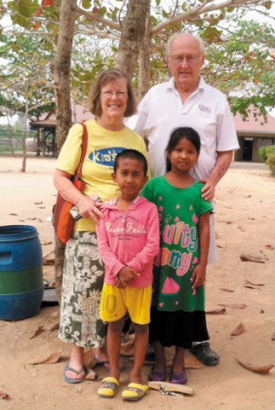 ￼Kaneohe's Sam Cox and Barbara Grace ‘Babs' Ripple with their Cambodian foster grandchildren Sophearak (left) and Sreyleap. PHOTO FROM COX AND RIPPLE.