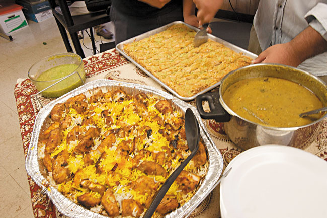 At One World Now!'s final meeting of the school year May 19, Arabic teacher Adly Mirza prepared sayadiya, dhal and baklawa.