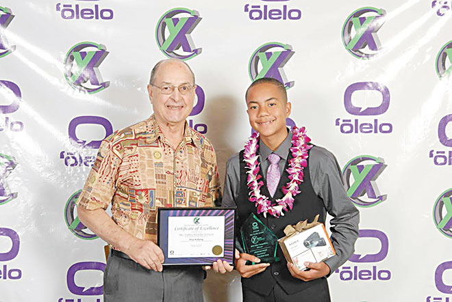Rotary Club of Honolulu member Dr. Byron Eliashof and Niu Valley Middle School eighth-grader Grayson Taeza-Gutter share a moment of triumph at the ‘Olelo video awards. Niu Valley's video team won for its ‘Stop Bullying' entry. PHOTO FROM DEBORAH SHARKEY. 